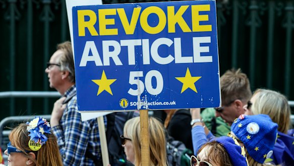 Anti-Brexit demonstrators attend a protest at Parliament Square in London on Tuesday.