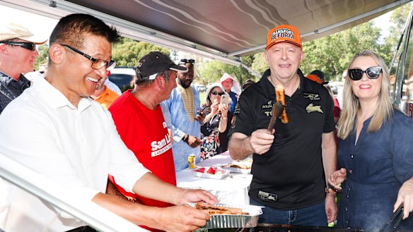 Anthony Albanese with his partner Jodie Haydon and Labor member for Tangney,  Sam Lim, at a barbecue during a campaign stop in the seat.