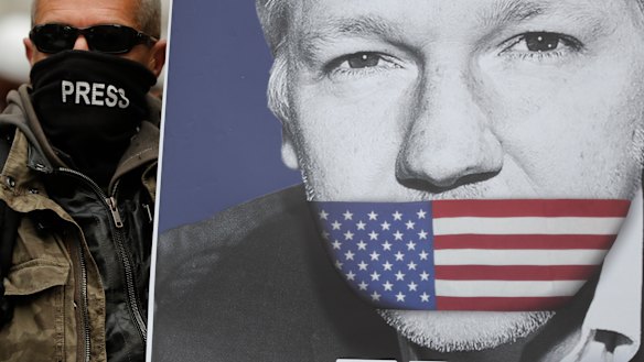 A supporter holds a poster of Julian Assange during a demonstration in London.