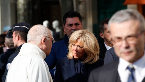 French First Lady Brigitte Macron, centre, arrives to attend a mass, as part of the Holy Week, at the Saint Sulpice Church in Paris.