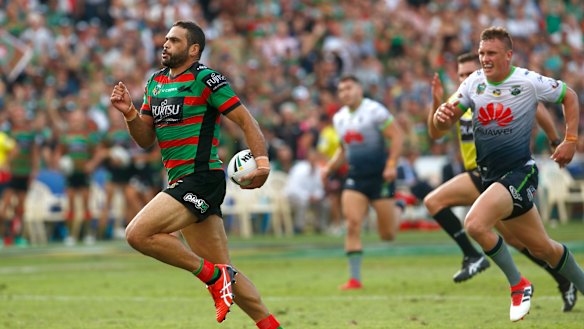 Intercept: Greg Inglis of the Rabbitohs races clear before scoring at at the Central Coast Stadium.