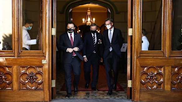 Freshly crowned NSW Premier Dominic Perrottet, right, and deputy Liberal leader Stuart Ayres, left, after the ceremony on Tuesday.