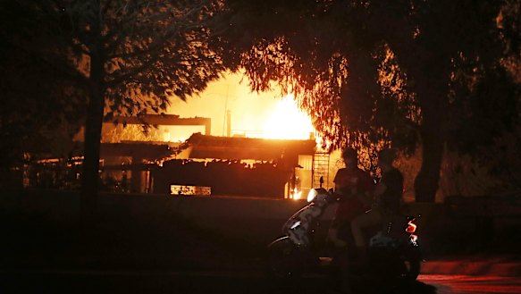 A house burns in the town of Mati, east of Athens.