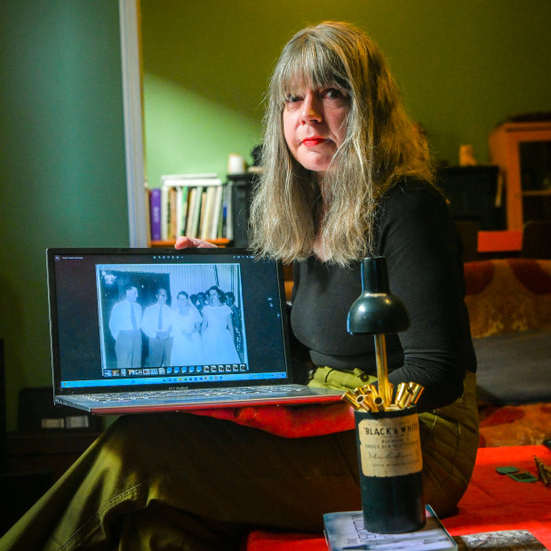 Helen O’Dare with the photo of her father and the mysterious bride, and the music box her father gave her.