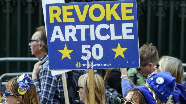 Anti-Brexit demonstrators attend a protest at Parliament Square in London on Tuesday.