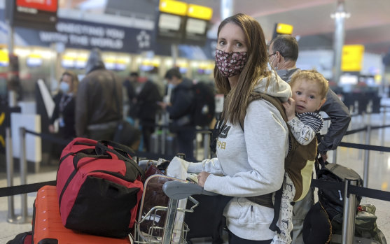 Kate Smith with her one-year-old son, Lleyton, at Heathrow Airport checking in for flight QF110 to Darwin, which landed on Friday.