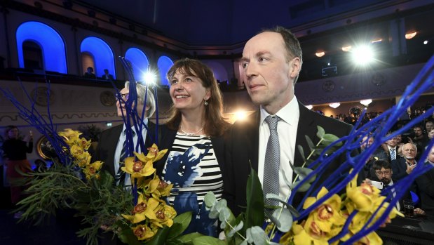 Chairman of The Finns Party Jussi Halla-aho, right, attends a post-election party on Sunday.