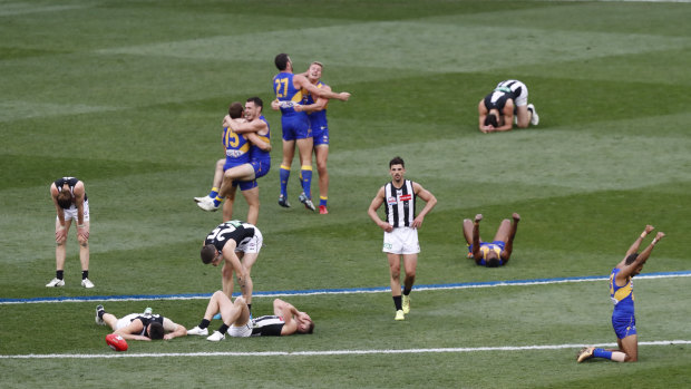 Agony and ecstasy: The Eagles and Magpies react after the final siren.
