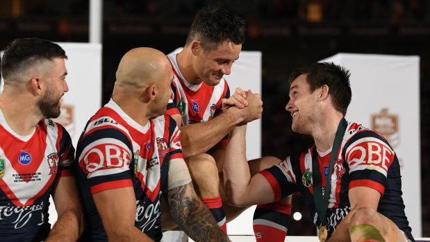 Not half bad: Clive Churchill Medallist Luke Keary (right) shakes hands with Cooper Cronk after winning the grand final.