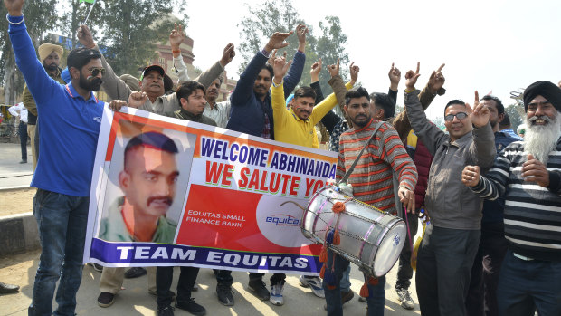 Indians dance as they wait to welcome Indian fighter pilot Wing Commander Abhinandan Varthaman at the border.