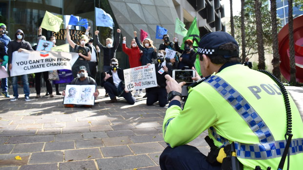 Extinction Rebellion protesters target the Perth HQ of Chevron on Friday morning.