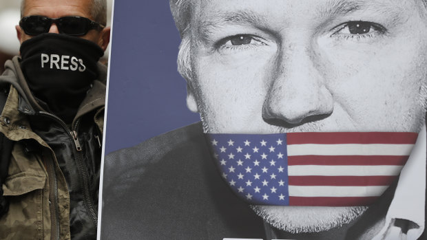 A supporter holds a poster of Julian Assange during a demonstration in London.