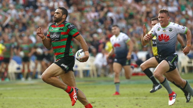 Intercept: Greg Inglis of the Rabbitohs races clear before scoring at at the Central Coast Stadium.