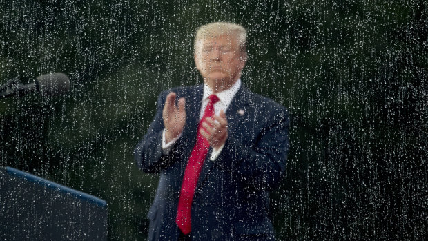 President Donald Trump applauds during an Independence Day celebration in front of the Lincoln Memorial on Thursday.