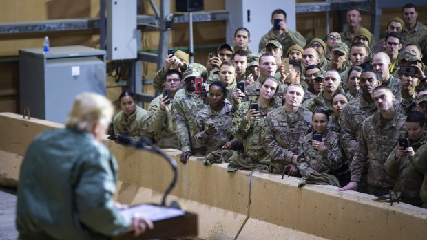 President Trump addresses troops during a visit to al-Asad Air Base in Iraq in December last year. 