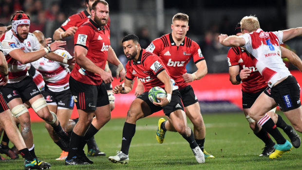 Linchpin: Richie Mo'unga splits the Lions defence during the Super Rugby final at AMI Stadium.