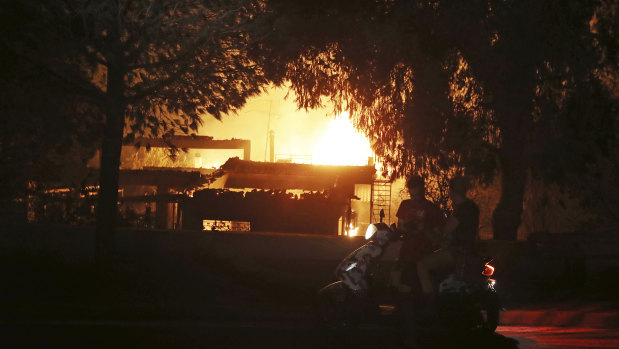 A house burns in the town of Mati, east of Athens.