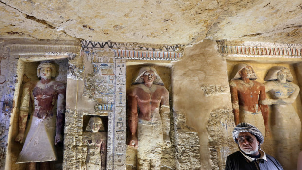 Saeed Abdel Aal, an excavation worker stands at the recently uncovered tomb of the Priest royal Purification during the reign of King Nefer Ir-Ka-Re.