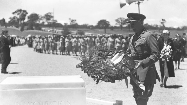 Lord Gowrie places a wreath