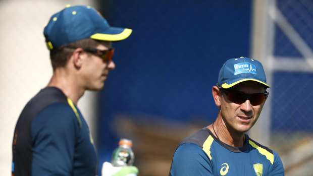 Justin Langer (right) with skipper Tim Paine.