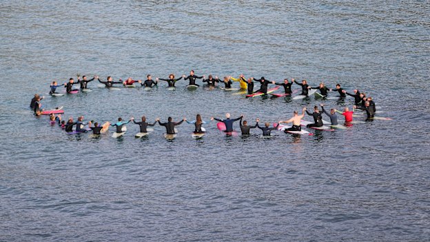 Locals formed a circle in Port Campbell to honour the father and son.