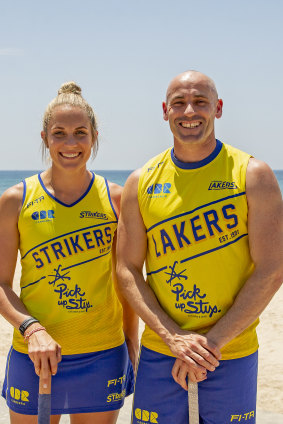 Canberra Strikers captain Edwina Bone with Canberra Lakers skipper Glenn Turner on the Gold Coast on Friday.
