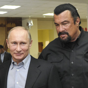 Best mates: Russian President Vladimir Putin and Steven Seagal in 2013.