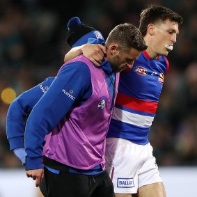 Laitham Vandermeer is helped from the field.