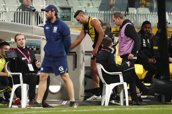 Shane Edwards leaves the field injured in the loss to Geelong.