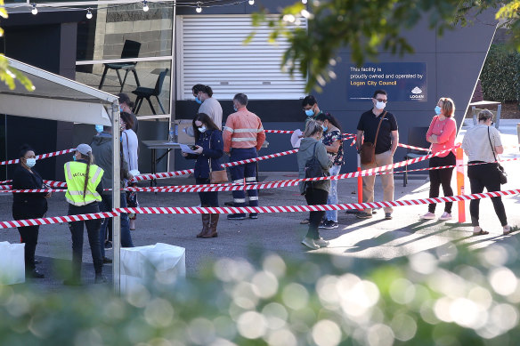 People line up outside a vaccination clinic at the Logan Entertainment centre last week.