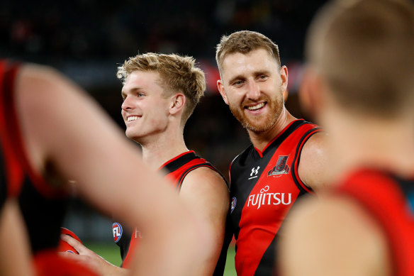 Skipper Dyson Heppell (right) has re-signed with Essendon.