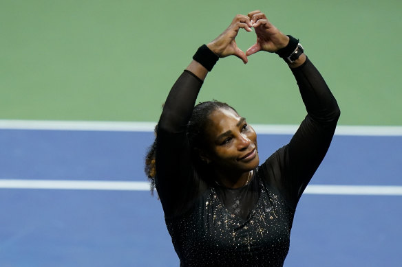 Serena Williams departs from the stage, making a heart to fans after her loss in the US Open.