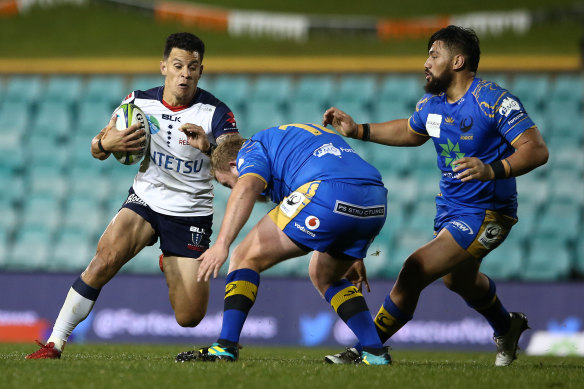 Matt Toomua of the Rebels on the run  on Friday night.