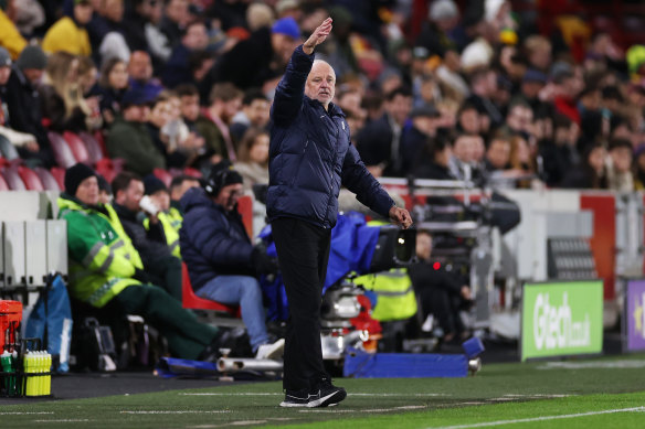 Socceroos coach Graham Arnold talks to his team from the sideline in Melbourne.