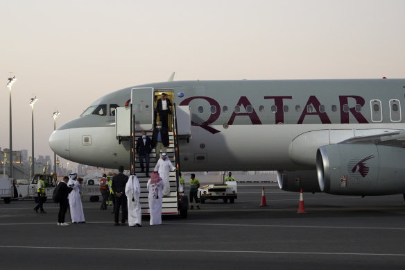 Emad Sharghi, Morad Tahbaz and Siamak Namazi, former prisoners in Iran, walk out of a Qatar Airways flight that brought them out of Tehran and to Doha.