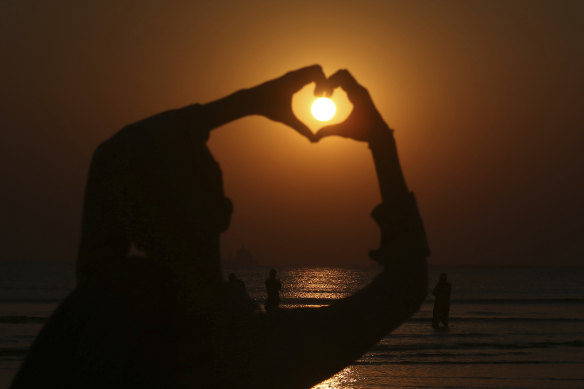 The sun sets on New Year's Eve in Karachi, Pakistan.