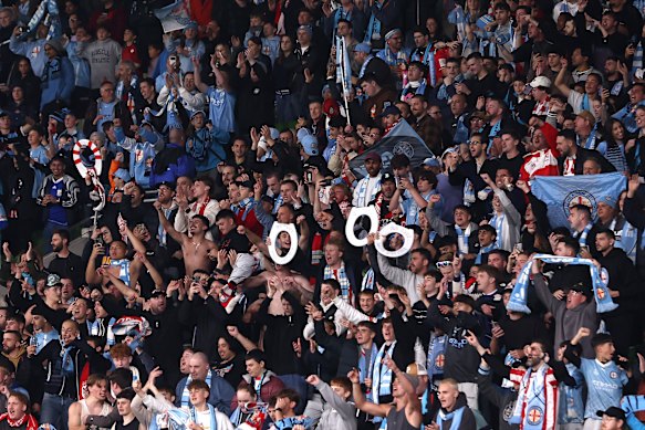 City fans celebrate after winning the A-League men grand final.