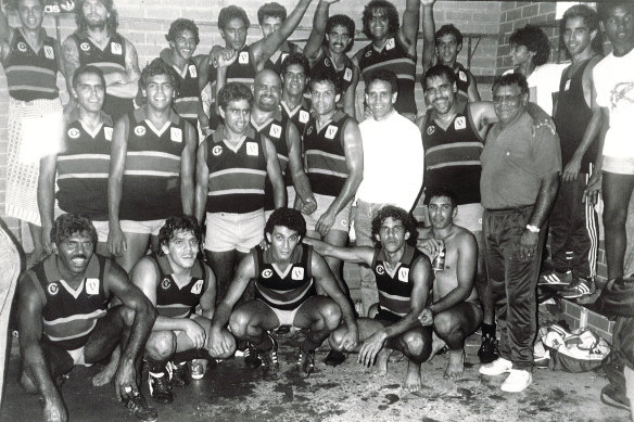 Paul Briggs, in the white top and jeans, with the Rumbalara team in 1989.