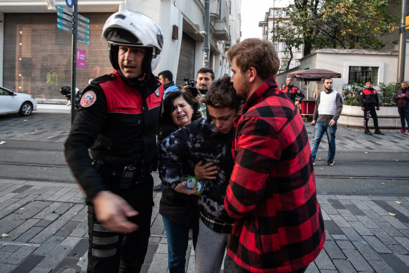  A boy separated from his parents is cared for after an explosion on Istiklal street, a busy pedestrian thoroughfare on November 13, 2022 in Istanbul, Turkey, after the explosion.