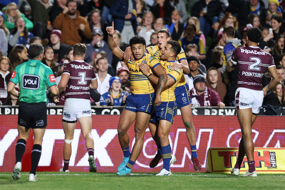 Waqa Blake celebrates a try with Eels teammates.