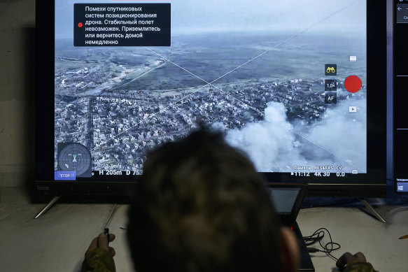 A Ukrainian soldier watches a drone feed from an underground command centre in Bakhmut.
