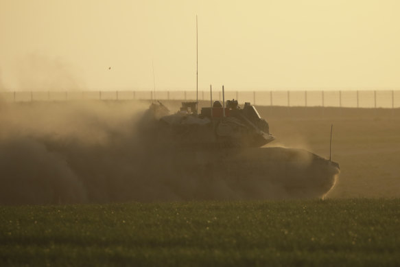 An Israeli tank moves near the border with the Gaza Strip in southern Israel.