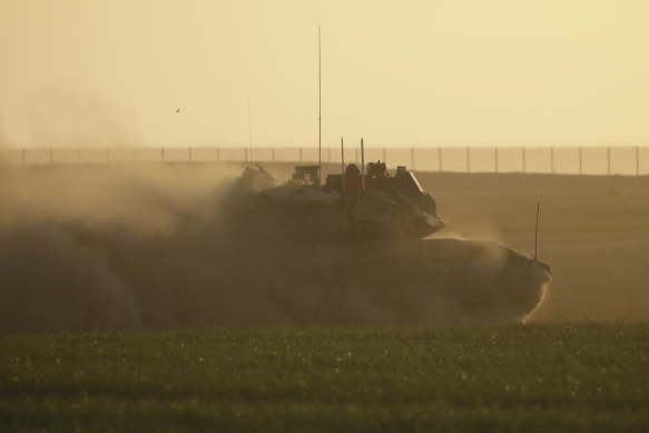 An Israeli tank approaches the border with the Gaza Strip in southern Israel. 
