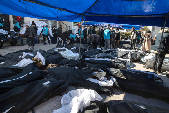 Body bags lie on the ground at a morgue carpark in Hatay, Turkey, on Thursday.