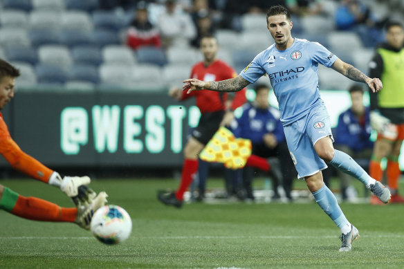 Melbourne City's Jamie Maclaren kicks a goal in round three against Western United. 
