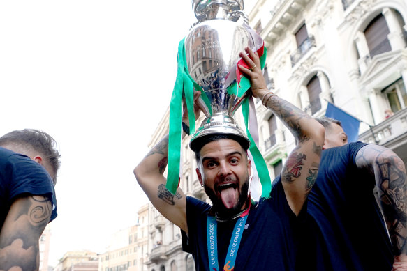 Lorenzo Insigne celebrates with the Euro 2020 trophy.