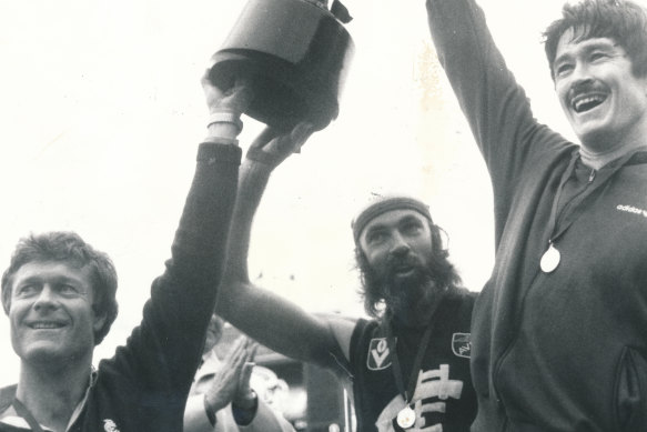 Mike Fitzpatrick (right) with coach David Parkin and star defender Bruce Doull and the 1982 premiership cup.