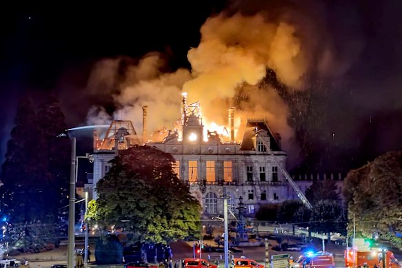 The 143-year-old town hall in the city of Limoges burns on Saturday night as riots spread across France.