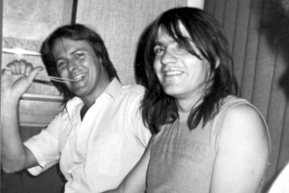 Crispin Dye (left) with AC/DC star Malcolm Young.