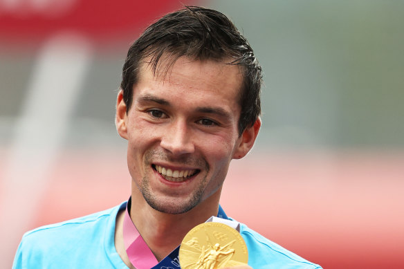 Slovenian Primoz Roglic with his gold medal. 
